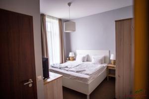 Selfness Hotel Vadvirág Mátraszentimre客房内的一张或多张床位