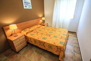 A bed or beds in a room at LITORAL COSTA DORADA - LAS CUMBRES Only families