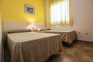 A bed or beds in a room at LITORAL COSTA DORADA - LAS CUMBRES Only families