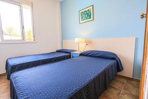 A bed or beds in a room at LITORAL COSTA DORADA - LAS CUMBRES Only families