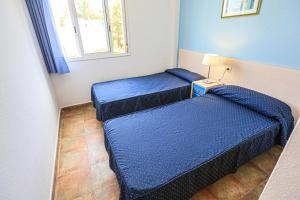 A bed or beds in a room at LITORAL COSTA DORADA - LAS CUMBRES Only families