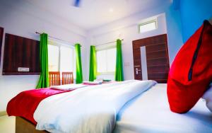 Postel nebo postele na pokoji v ubytování Manzil Hostel