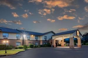 a hotel with a parking lot in front of it at Super 8 by Wyndham Cornwall ON in Cornwall