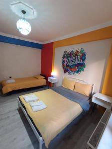 a bedroom with two beds and a sign on the wall at Deeps Hostel Eskişehir in Eskisehir