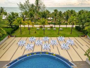 an aerial view of a resort with tables and chairs at Best Western Premier Sonasea Phu Quoc in Phu Quoc