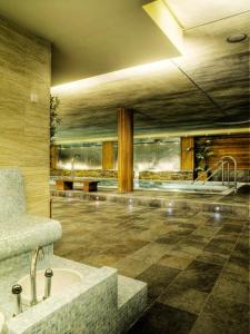 a bathroom with a sink in a room at Poseidon La Manga Hotel & Spa - Designed for Adults in La Manga del Mar Menor