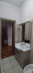 a bathroom with a sink and a mirror at Casa Vacanze SOFIA in Bolsena