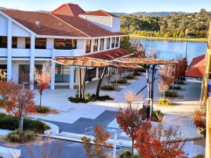an overhead view of a building with a lake at Tuggeranong Short Stay #06C - Sleeps 6 in Canberra