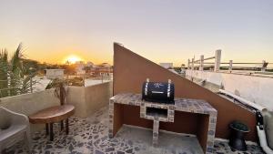 Μια τηλεόραση ή/και κέντρο ψυχαγωγίας στο Nice CONDO close to the Beach Puerto Morelos- Ground Floor-King