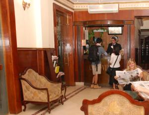a group of people standing in a room at City View Museum Hotel in Cairo