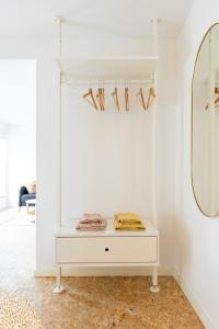 a white dressing table in a room with a mirror at Le Gîtel in Spa