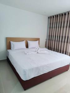 Postel nebo postele na pokoji v ubytování One Dream Hotel
