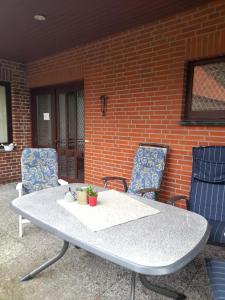 a table and two chairs on a patio at Grosse Wohnung in Top-Lage in Langwedel (BREMEN) in Langwedel