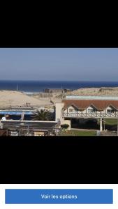 a screenshot of a picture of a house and a train at Bel appartement climatisé refait à neuf 100 m de l'océan et toutes commodités 3 e étage sans ascenseur in Seignosse +1 photo