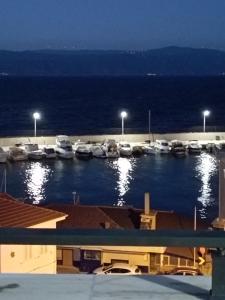 a group of boats parked in a marina at night at The Blue House in Burgaz