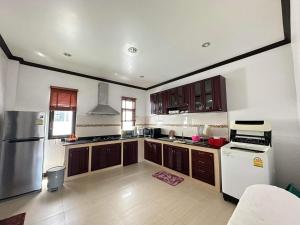 A kitchen or kitchenette at Best Pool villa 3 rooms 3 bathrooms