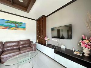 A television and/or entertainment centre at Best Pool villa 3 rooms 3 bathrooms