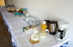 a table with milk and other items on it at Lokunja Bed&Breakfast in Pag