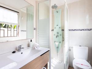a bathroom with a shower and a sink and a toilet at Holiday Home Barreto by Interhome in Puerto de la Cruz