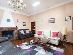 a living room with a couch and a fireplace at Holiday Home Barreto by Interhome in Puerto de la Cruz +39 photos