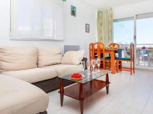 a living room with a couch and a table at Apartment Florida by Interhome in Miami Platja