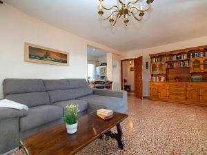 a living room with a couch and a coffee table at Holiday Home Casa de las Rosas by Interhome in L’Alfàs del Pi