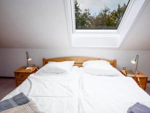 Ein Bett oder Betten in einem Zimmer der Unterkunft Apartment Muschelweg-1 by Interhome