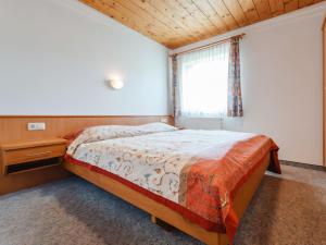 A bed or beds in a room at Apartment Voithofer-7 by Interhome