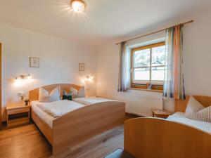 Postel nebo postele na pokoji v ubytování Holiday Home Erlachhof by Interhome