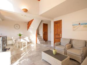 a living room with a couch and a table at Holiday Home Le Belvédère by Interhome in Saint-Clair