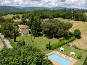 an aerial view of a house and a pool in a field at Villa Laura by Interhome in Agna
