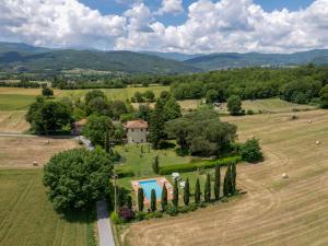 an aerial view of a farm with a house and a pool at Villa Laura by Interhome in Agna
