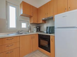 Kuchyň nebo kuchyňský kout v ubytování Apartment Mlasina-4 by Interhome