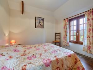 a bedroom with a bed and a window at Holiday Home La Voisinière no- 3 by Interhome in Savigny