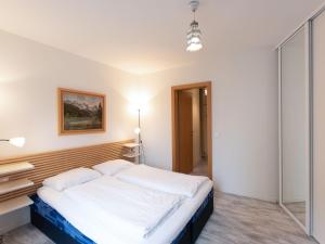 Łóżko lub łóżka w pokoju w obiekcie Apartment IVA by Interhome