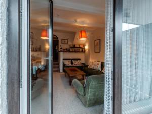 a living room with a couch and a table at Apartment Sonnenappartements by Interhome in Bad Hofgastein