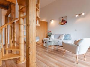 a living room with a couch and a table at Apartment Anna-Katharina by Interhome in Bad Hofgastein