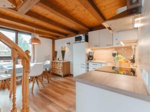 a kitchen and dining room with a table and chairs at Apartment Anna-Katharina by Interhome in Bad Hofgastein