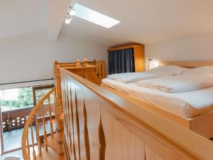 a bedroom with two beds and a balcony at Apartment Anna-Katharina by Interhome in Bad Hofgastein