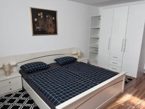 a bedroom with a bed with a blue mattress at Apartment Gloggnitz by Interhome in Gloggnitz