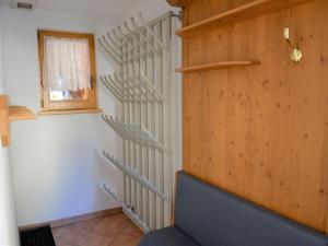 a staircase in a room with a window and a chair at Apartment Silvretta by Interhome in Kappl