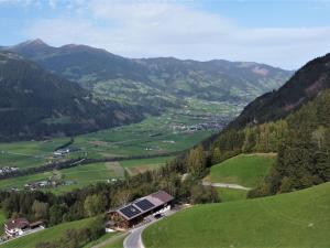 a view of a valley with a farm and mountains at Apartment Martina by Interhome in Gattererberg