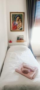 Cama ou camas em um quarto em La Casa di Amelie