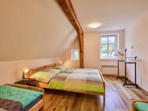 a bedroom with two beds and a window at Apartment Meda by Interhome in Bolkov +31 photos