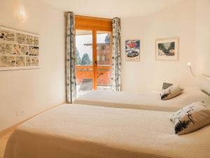 Postel nebo postele na pokoji v ubytování Apartment Les Cîmes 8 by Interhome