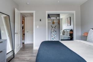 a bedroom with a large bed with a blue blanket at Santa Clara 1br w pool ac nr tech hub SFO-1486 in Santa Clara
