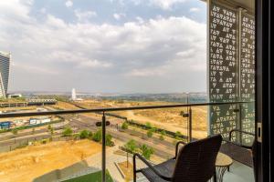 a view from the balcony of a building at AlimamaSpaces The Moksit Suite Ellipse in Midrand