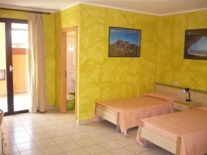 Postel nebo postele na pokoji v ubytování Rosa Hotel
