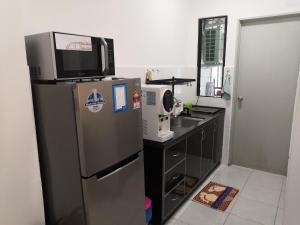 Kuchyň nebo kuchyňský kout v ubytování Hamin De Thor Homestay-Benoni Garden Apartment