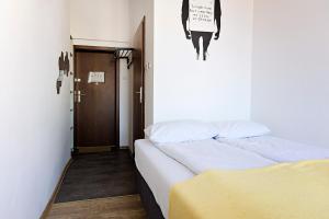 Posteľ alebo postele v izbe v ubytovaní Folk Hostel